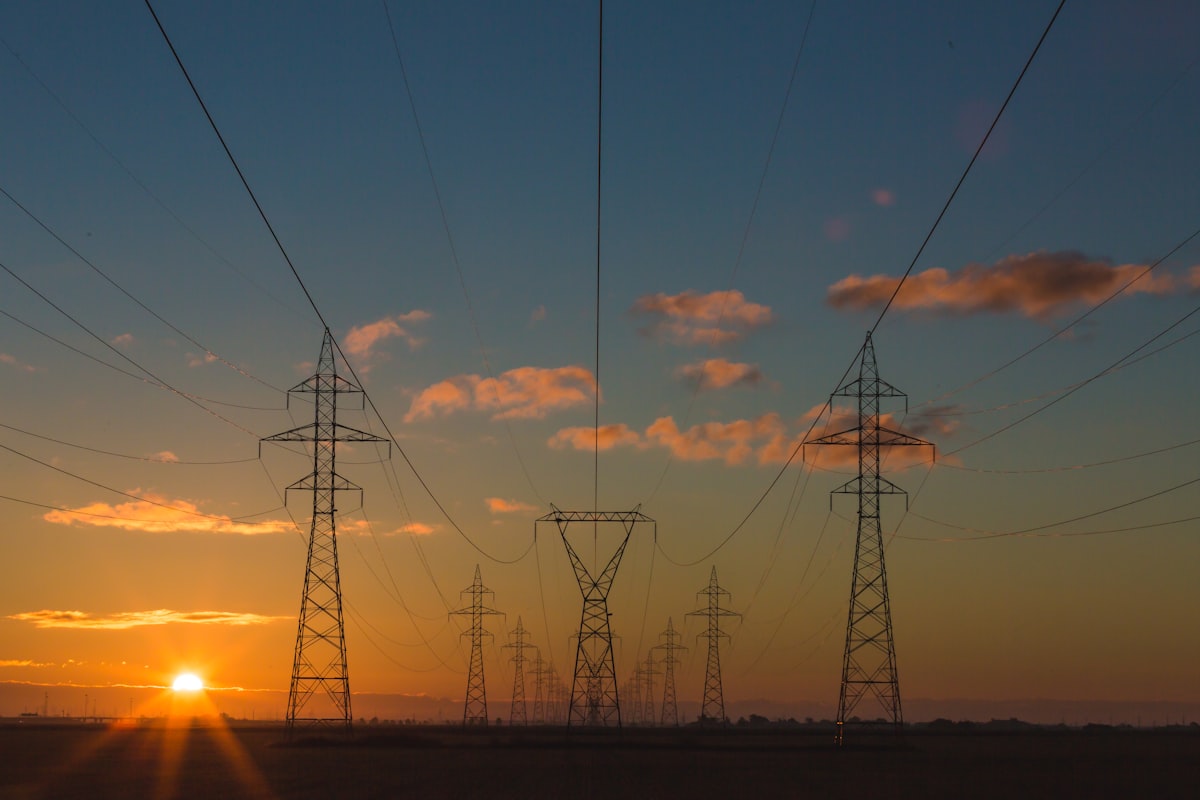 Power transmission towers at sunset